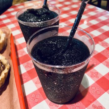 Terry Black's Barbecue - Black Margaritas - made with with tequila, mezcal, and triple sec mixed with their secret black margarita mix.  Salud! - Barbeque Near Me - Austin, Texas