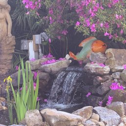 Water feature in their flower garden Water feature in their flower garden