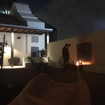 Texican Court - Fun hangout fire pits/rocking chairs/bean bags in courtyard - Hotels Near Me - Irving, Texas Texican Court - Fun hangout fire pits/rocking chairs/bean bags in courtyard - Hotels Near Me - Irving, Texas