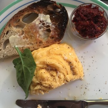 Granger & Co - Scrambled eggs and sourdough toast with a side of rose harissa - Modern European Near Me - London, XGL Granger & Co - Scrambled eggs and sourdough toast with a side of rose harissa - Modern European Near Me - London, XGL