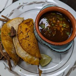 Birria tacos and consommé