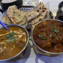 Lamb korma, chicken vindaloo and naan bread Lamb korma, chicken vindaloo and naan bread
