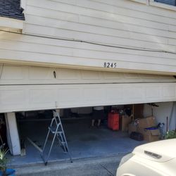 DoorCraft Garage Doors - Garage door off track and cables off