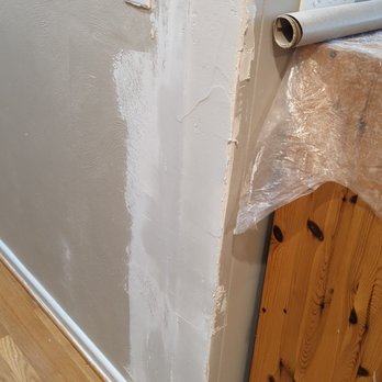 Home & Land Repairs - doorway sheetrock left unfinished - Handyman Near Me