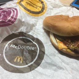 a burger and a drink on a table a burger and a drink on a table