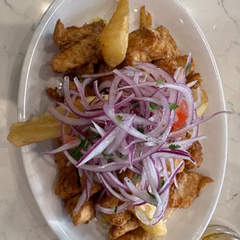 The Peruvian Kitchen - a plate of food and a glass of beer - Peruvian Near Me - North Miami Beach, Florida The Peruvian Kitchen - a plate of food and a glass of beer - Peruvian Near Me - North Miami Beach, Florida