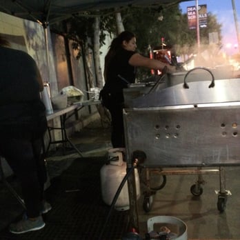 Rico's Tacos - Getting down in her sidewalk kitchen - Street Vendors Near Me - Los Angeles, California