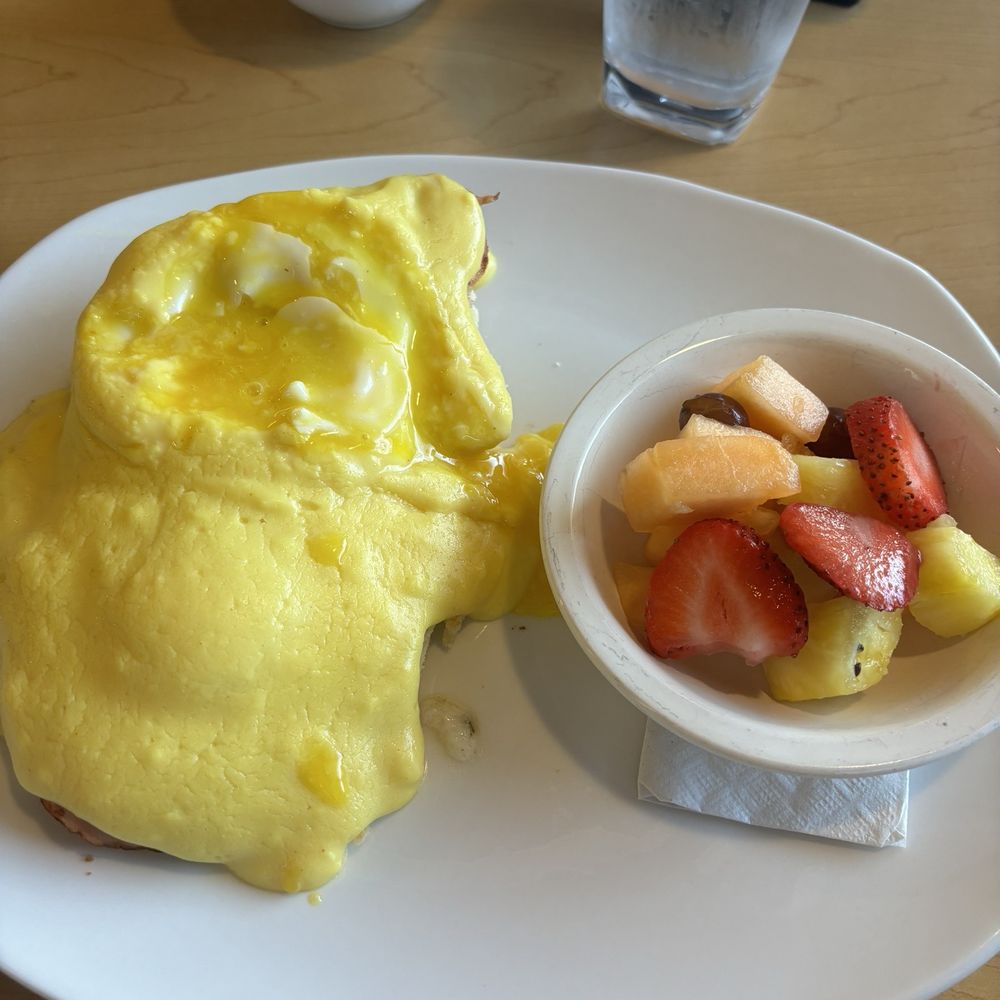 Biscuit Benedict with a side of fruit Biscuit Benedict with a side of fruit