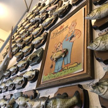 Flying Fish - The walls are covered in Billy Bass! Lol - Seafood Near Me - Little Rock, Arkansas