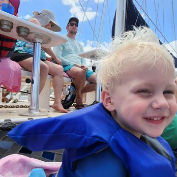 Trilogy Excursions - One of my kids, sitting on the netting where we spent most of the tour - Snorkeling Near Me - Lahaina, Hawaii