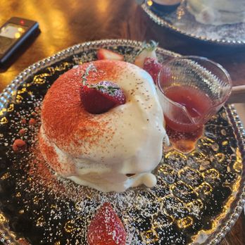 Cafe 104 - Three fluffy pancakes with a light whip cream on top.sprinkled with strawberry powder,fresh strawberry thrown ontop,strawberry syrup inc. - Breakfast & Brunch Near Me - Duluth, Georgia Cafe 104 - Three fluffy pancakes with a light whip cream on top.sprinkled with strawberry powder,fresh strawberry thrown ontop,strawberry syrup inc. - Breakfast & Brunch Near Me - Duluth, Georgia