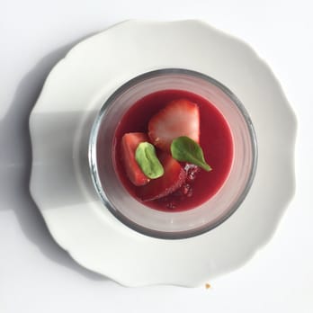 Maesmi - a white plate with a strawberry and basil garnish - Cafes Near Me - Montreal, Quebec