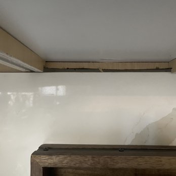 MTD Kitchen - Underneath the top cabinets.  Burn marks where the installer cut. - Cabinetry Near Me - North Hollywood, California