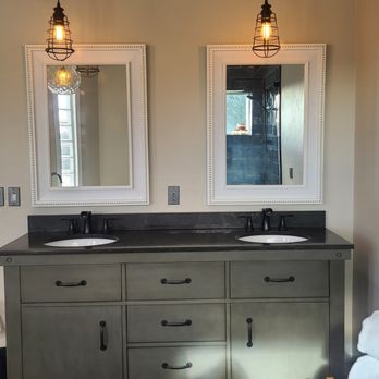 Mr Everything - a bathroom with two sinks and two mirrors - Handyman Near Me Mr Everything - a bathroom with two sinks and two mirrors - Handyman Near Me