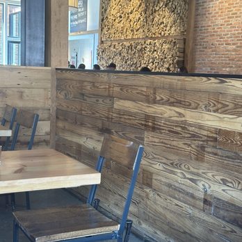 The Millworks - Custom welded chairs and a stacked firewood wall and light-diffusing muslin overhead were just three of the unique decor items. - New American Near Me - Harrisburg, Pennsylvania