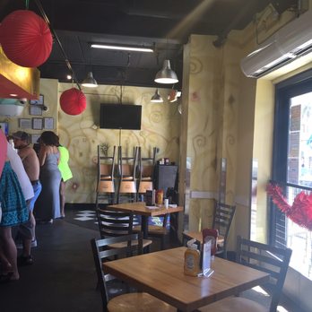 Wet Willie's - A view of the line you stand in to order your drink. There are 4 tables inside & lots of chairs out front to sit in. - Cocktail Bars Near Me - Tybee Island, Georgia