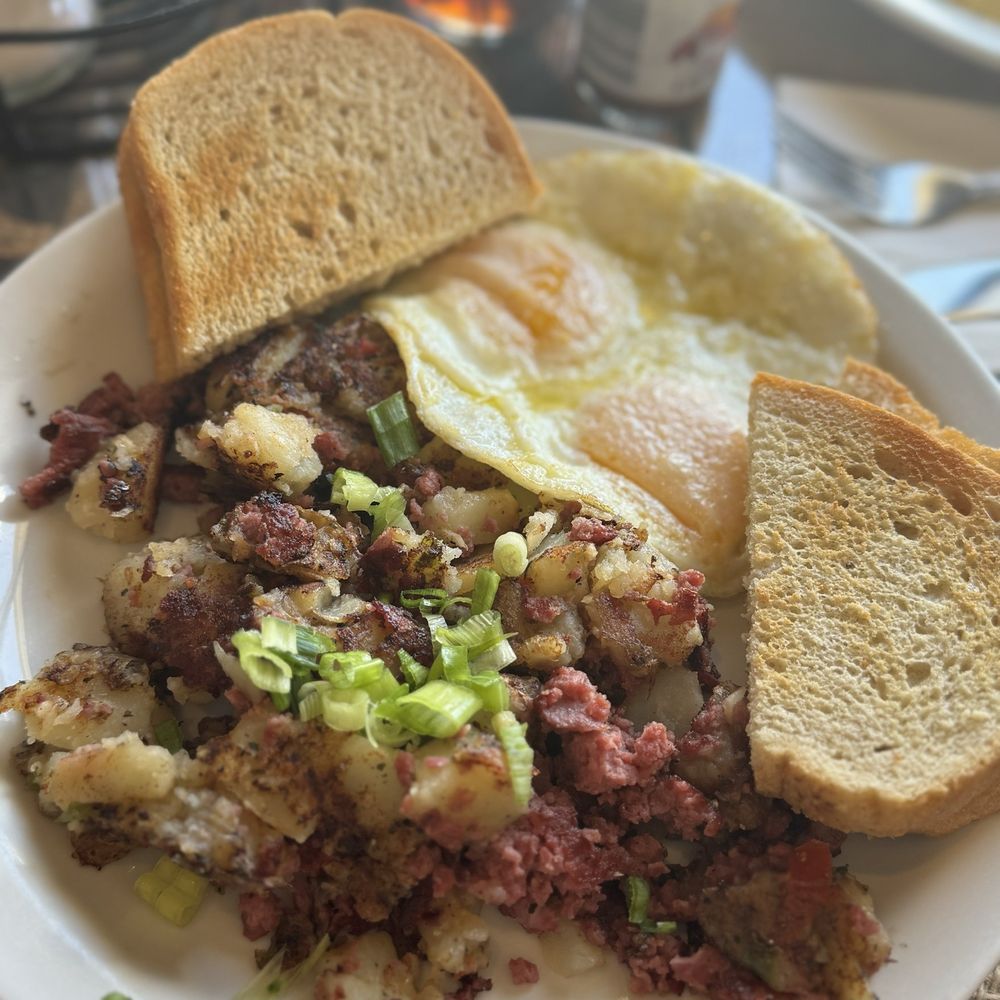 Crossroads Cafe - Corn Homemade Corned Beef Hash, over medium egg and sourdough toast - Cafes Near Me - Joshua Tree, California Crossroads Cafe - Corn Homemade Corned Beef Hash, over medium egg and sourdough toast - Cafes Near Me - Joshua Tree, California