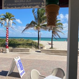 an ice cream shop on the beach an ice cream shop on the beach