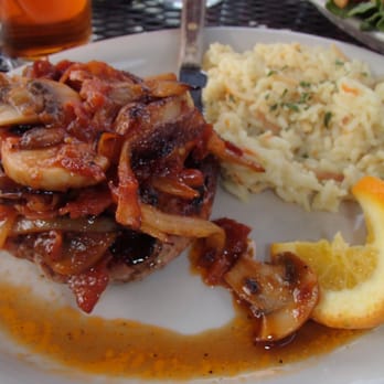 Longfellow's Restaurant - Pork Rib eye with Grilled Bacon, Onion and Mushroom Bourbon BBQ Sauce - New American Near Me - Kingfield, Maine