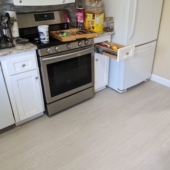 J.V's Floorcoverings - The flooring was laid below the kitchen appliances as well. - Carpet Installation Near Me
