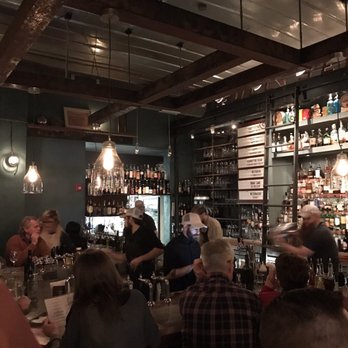 Leon's Full Service - View of the bar while waiting to be seated. POV from standing table at indoor/outdoor boundary. Cool spot! - Gastropubs Near Me - Decatur, Georgia
