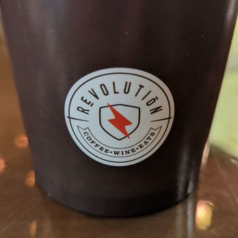Revolution - a cup of coffee on a table - Wine Bars Near Me - Black River Falls, Wisconsin
