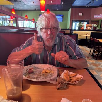 Fuddruckers - pops enjoying his food - Burgers Near Me - Succasunna, New Jersey