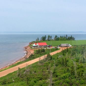 Point Prim Chowder House - View of the restaurant from the local lighthouse. - Seafood Near Me - Charlottetown, Prince Edward Island Point Prim Chowder House - View of the restaurant from the local lighthouse. - Seafood Near Me - Charlottetown, Prince Edward Island