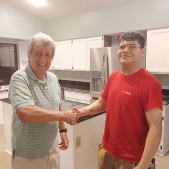 NTC Renovations - Here's a photo of Jose, our project manager with Dan, one of loyal customers! We had just repainted the cabinets you see behind them. - General Contractors Near Me NTC Renovations - Here's a photo of Jose, our project manager with Dan, one of loyal customers! We had just repainted the cabinets you see behind them. - General Contractors Near Me