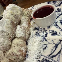 Beignets with blackberry sauce.