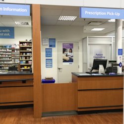 Walmart Pharmacy - Info and pick-up counters.