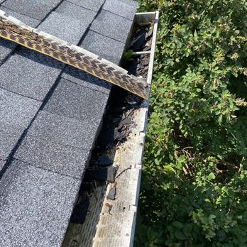Capital Home Improvements - Gutter guard twisted up and not replaced More debris left in gutters - Roofing Near Me - Syracuse, New York