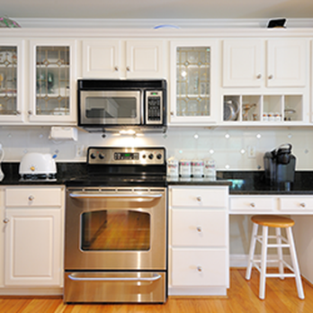Sumrick Builders - a clean kitchen with stainless steel appliances - General Contractors Near Me - Lake Ronkonkoma, New York
