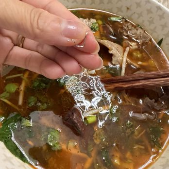 Pho Tango - Bun Bo Hue with a metal piece found in food. - Vietnamese Near Me - Auburn, Washington