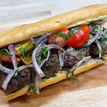 Big Bites - a meatball sandwich with tomatoes and onions - Caterers Near Me - San Francisco, California