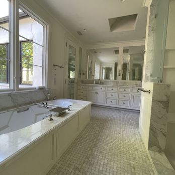Del Rio Stone - New Ravens Stock custom mosaic on floor, tub deck with DuPont Offset straight edge, slab shower door jambs - Flooring Near Me - San Carlos, California Del Rio Stone - New Ravens Stock custom mosaic on floor, tub deck with DuPont Offset straight edge, slab shower door jambs - Flooring Near Me - San Carlos, California