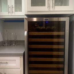 Former 1/2 bath and coat closet transformed into wine room with custom cabinets. Former 1/2 bath and coat closet transformed into wine room with custom cabinets.