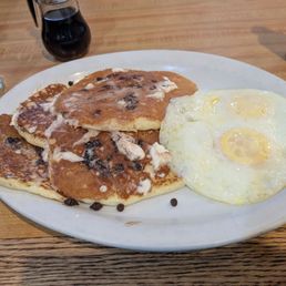 Chocolate Chip Pancakes (requested thin and delivered!) and over medium eggs! Tasty, affordable, and an all in one combo