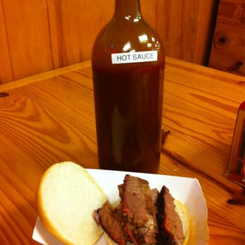 Dozier's BBQ - Jumbo bottle of hot sauce, pretty good. - Meat Shops Near Me - Fulshear, Texas