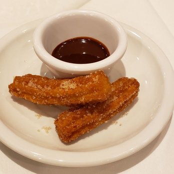 Seasoned - churros and dipping sauce on a white plate - American Near Me - Glens Falls, New York Seasoned - churros and dipping sauce on a white plate - American Near Me - Glens Falls, New York
