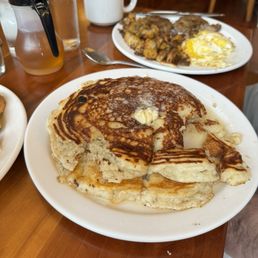 a plate of pancakes and eggs a plate of pancakes and eggs