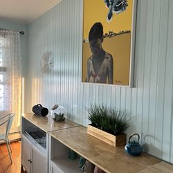 Inkwell Beach House - Dining area for complimentary breakfast.  Young man in art appears to be on the beach, the Inkwell.