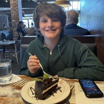 Local Table - Kid eating the mousse cake! - New American Near Me - Cypress, Texas