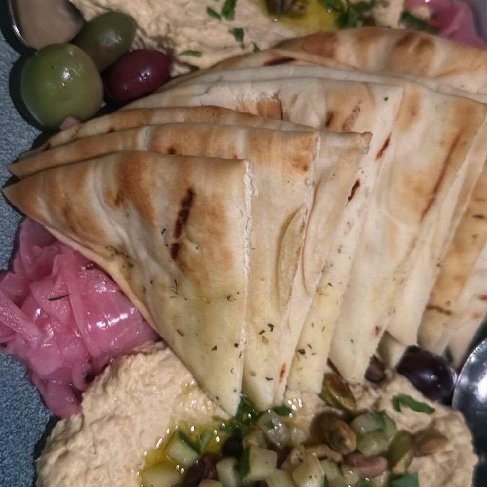 Balkan The Greek Restaurant - Dip Duo - ZUCCHINI PISTACHIO HUMMUS and BRAISED LAMB HUMMUS - Greek Near Me - Banff, Alberta Balkan The Greek Restaurant - Dip Duo - ZUCCHINI PISTACHIO HUMMUS and BRAISED LAMB HUMMUS - Greek Near Me - Banff, Alberta
