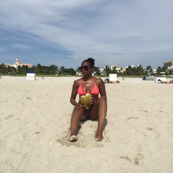 Cafe Bonjour - Me on the beach with my delicious coconut water - Cafes Near Me - Miami Beach, Florida