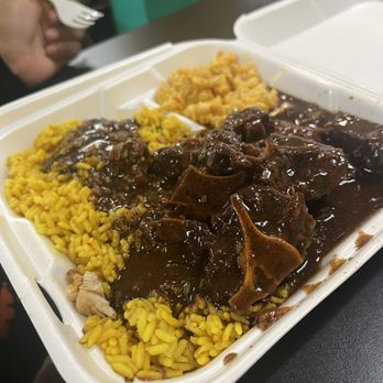 Jamaican Vibes Restaurant - Ox Tails with yellow rice and extra gravy - Caribbean Near Me - Mobile, Alabama Jamaican Vibes Restaurant - Ox Tails with yellow rice and extra gravy - Caribbean Near Me - Mobile, Alabama