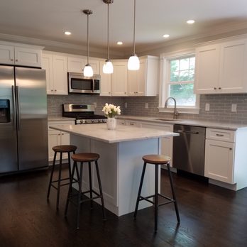 Landmark Home Improvements - a kitchen with stainless steel appliances - General Contractors Near Me Landmark Home Improvements - a kitchen with stainless steel appliances - General Contractors Near Me