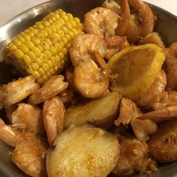 Cap't Loui - Shrimp with heads off in Cap't Loui sauce, All seafood boils come with corn and potatoes. - Seafood Near Me - Cupertino, California