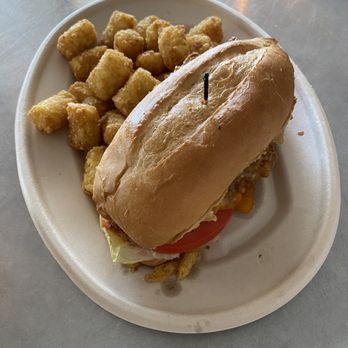 The Twisted Prop Bar & Grille - Fried Chicken Sandwich with Tater Tots - American Near Me - Winter Haven, Florida