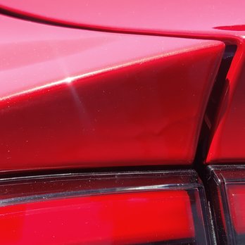 Diamond Hills Collision Center - Paint runs on the left quarter panel. Notice how the paint shines in the sun; they used white pearls instead of red. - Body Shops Near Me - Orange, California